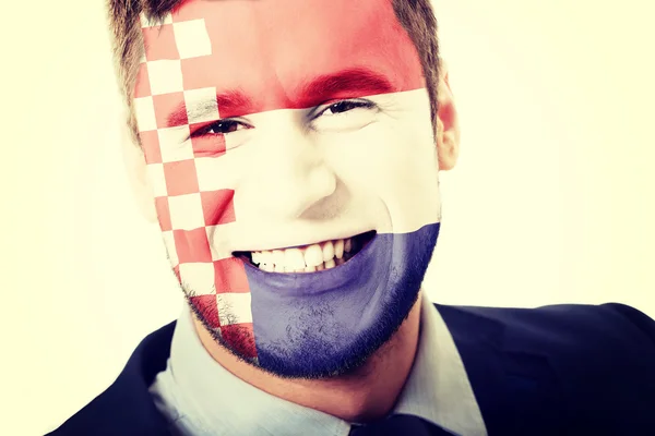 Szczęśliwy człowiek z Chorwacja Flaga na twarz. — Zdjęcie stockowe