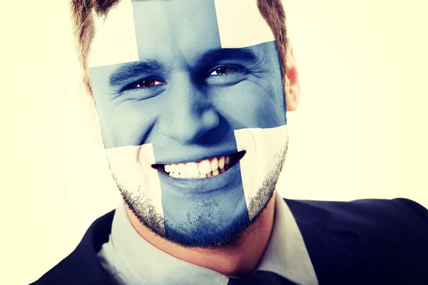 Ευτυχισμένος άνθρωπος με σημαία της Φινλανδίας στο πρόσωπό. — Φωτογραφία Αρχείου