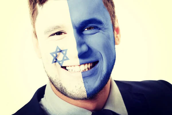 Gelukkig man met Israël vlag op gezicht. — Stockfoto