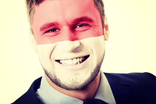 Happy man with Monaco flag on face.