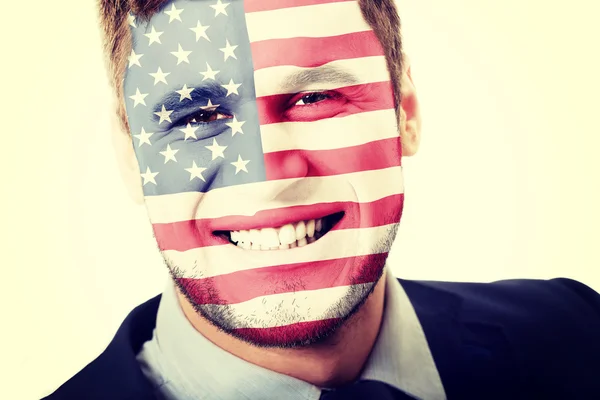 Hombre feliz con bandera de EE.UU. en la cara . — Foto de Stock