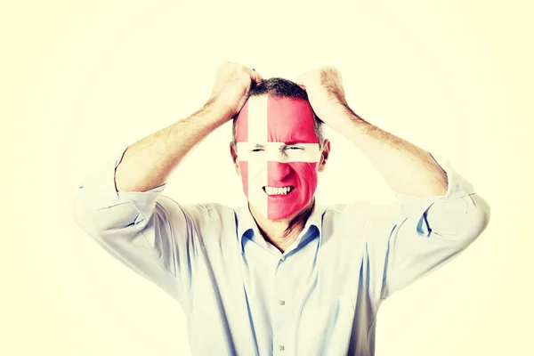 Mature man with Denmark flag on face. — Stock Photo, Image