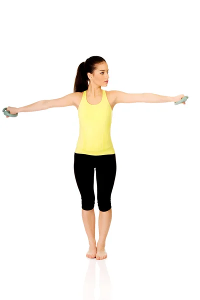 Active woman holding weights. — Stock Photo, Image