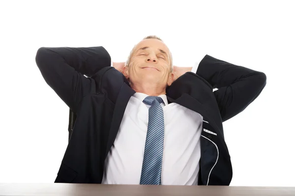 Mature businessman resting in armchair — Stock Photo, Image