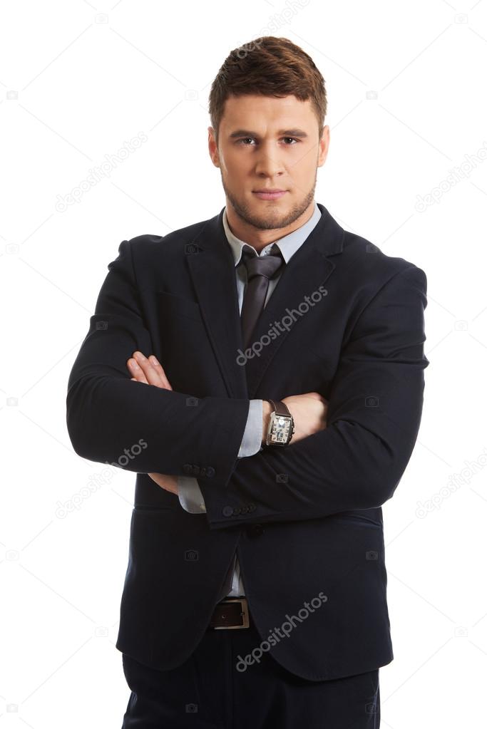 Successful businessman with folded arms.
