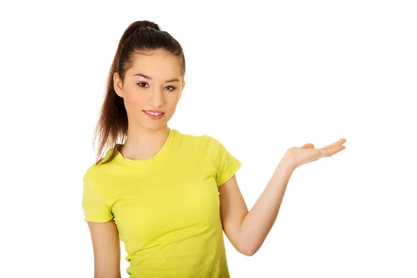 Woman holding something on palm. — Stock Photo, Image