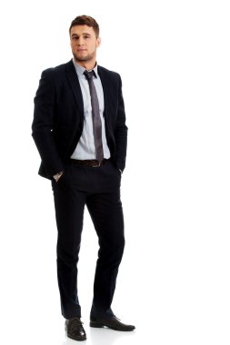 Elleri ceplerinde başarılı iş adamı.
