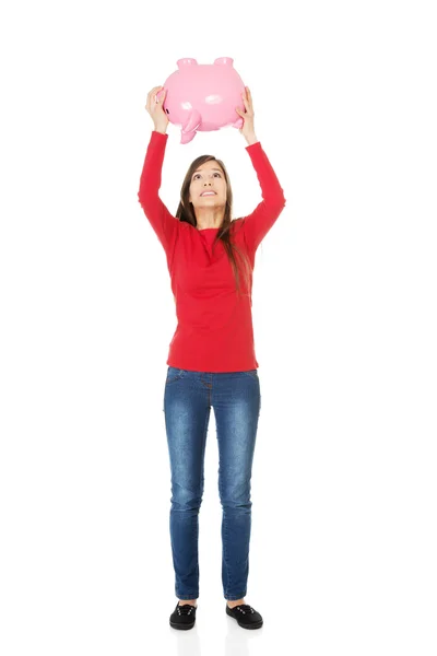 Feliz joven mujer con piggybank . — Foto de Stock