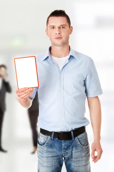 Happy man showing and displaying placard — Stock Photo, Image