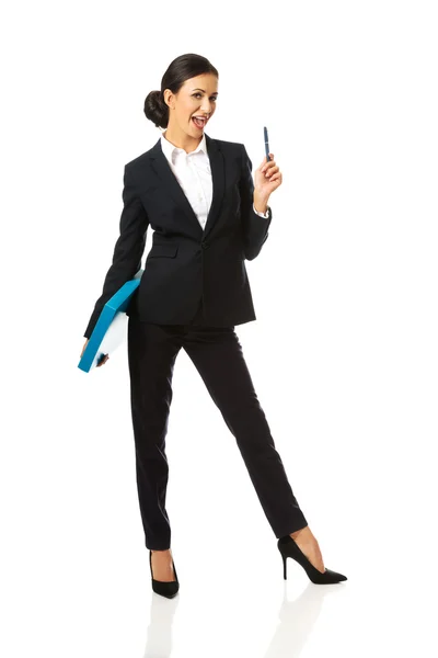 Happy businesswoman holding a pen — Stock Photo, Image