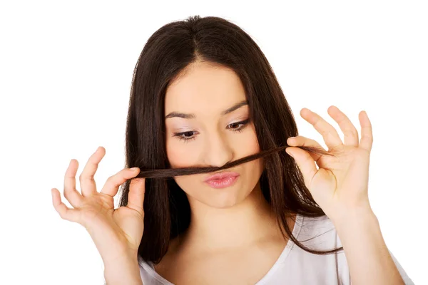 Teen woman putting hair like moustache. — Stock Photo, Image