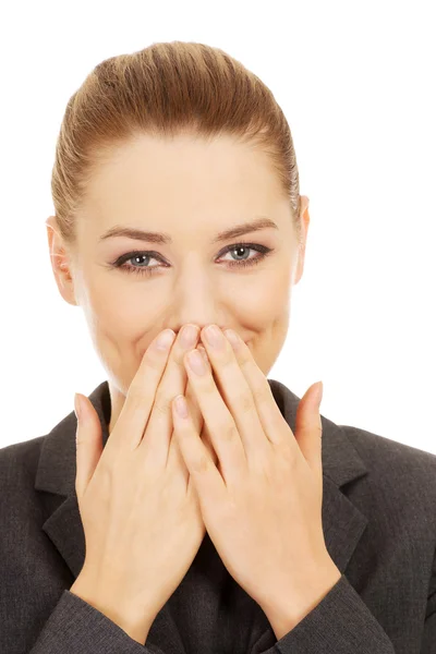 Businesswoman covering mouth with hands. — Stock Photo, Image