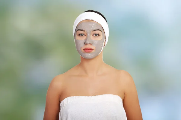 Relaxed woman with a nourishing face mask — Stock Photo, Image