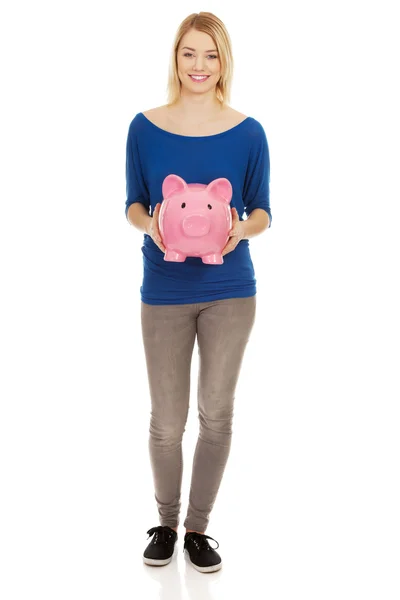 Happy woman holding piggybank. — Stock Photo, Image