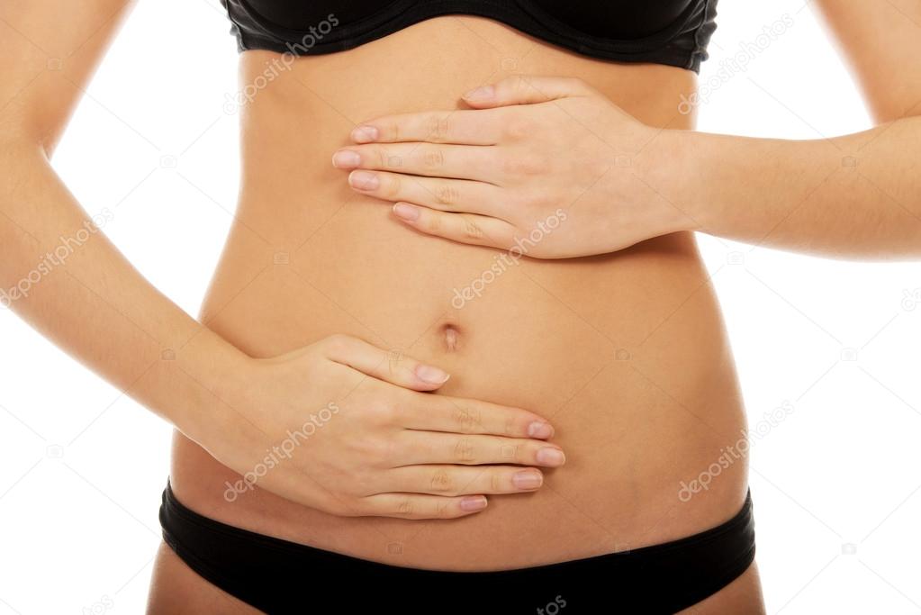 Woman touching her belly.