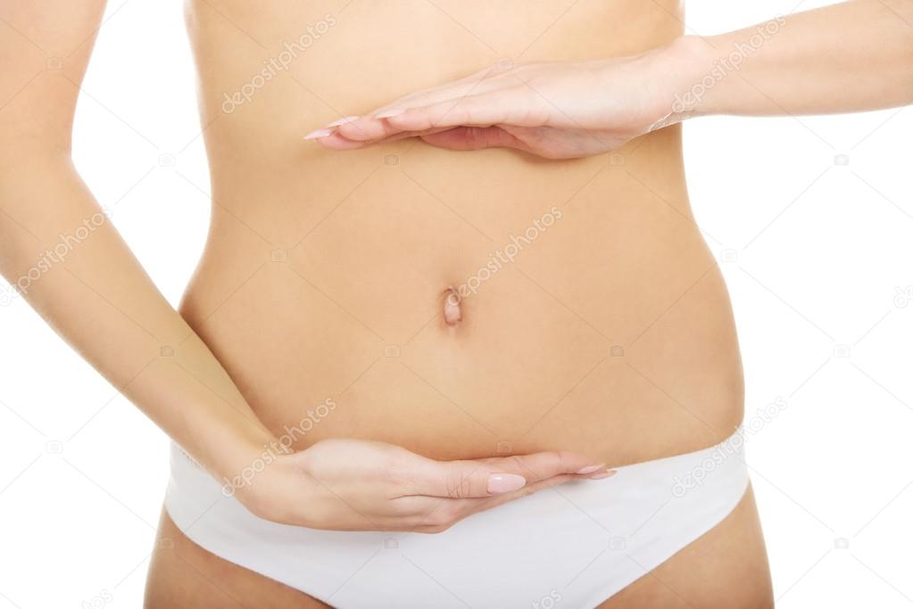 Woman cares for her belly.