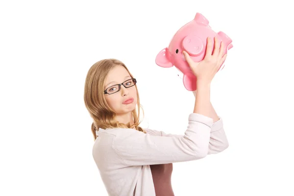 Joven mujer holding piggybank —  Fotos de Stock