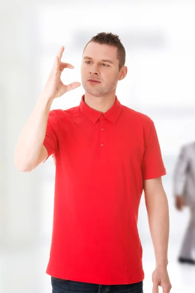 Excited man showing copy space — Stock Photo, Image