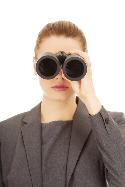 Businesswoman looking through binoculars. — Stock Photo, Image