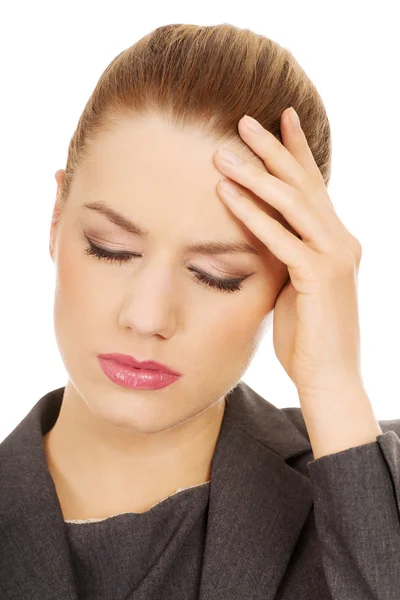 Businesswoman with head ache. — Stock Photo, Image