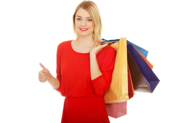 Femme avec beaucoup de sacs à provisions. — Photo