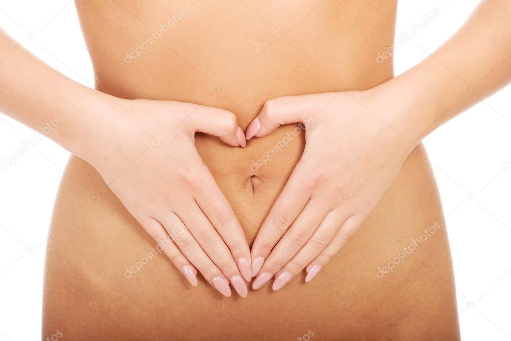 Woman with her hands on belly.