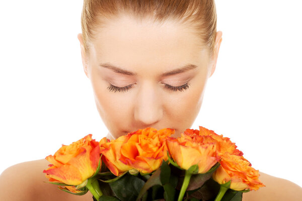 Smiling woman with fresh roses.