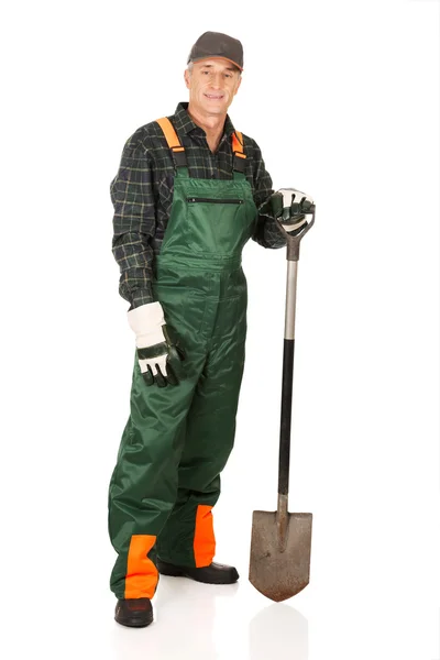 Mature gardener with a spade — Stock Photo, Image