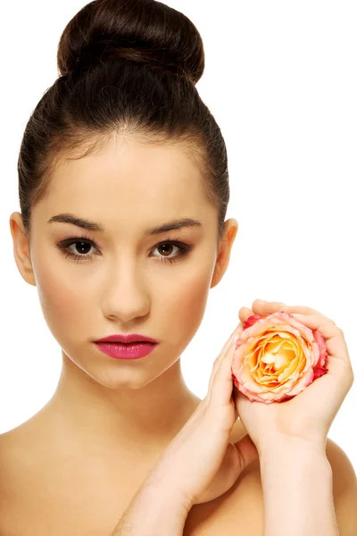 Beautiful woman with pink rose. — Stock Photo, Image