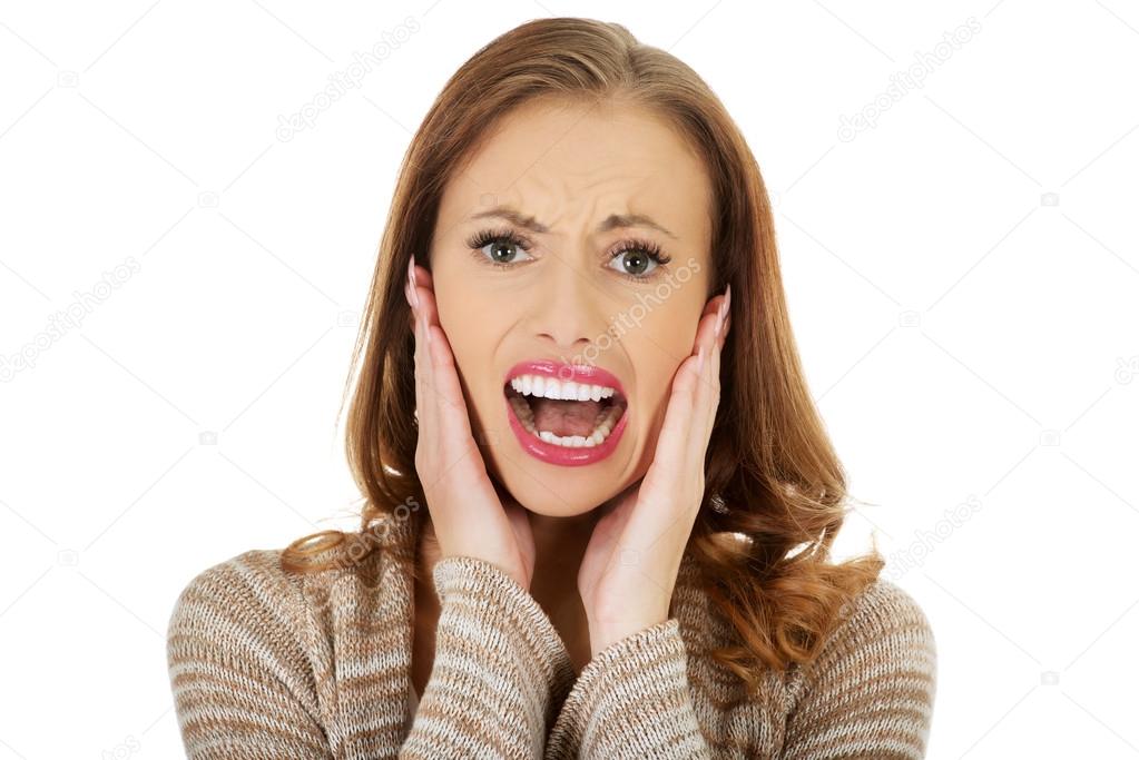 Scared woman screaming.