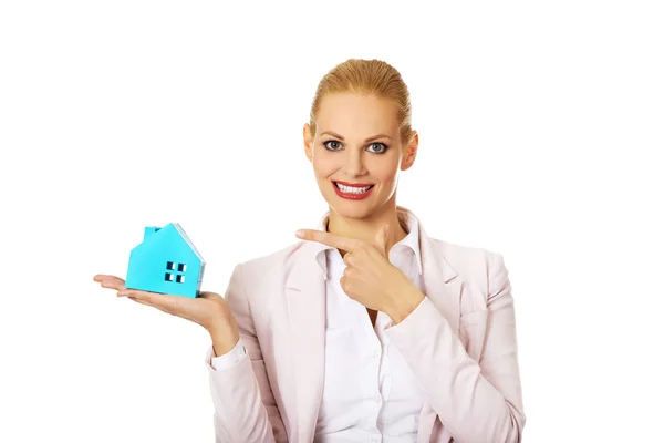 Smile business woman holding a paper house — Stock Photo, Image