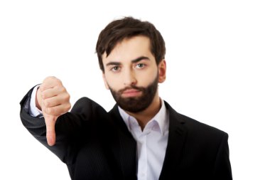 Başparmak aşağı hareketi ile mutsuz işadamı.