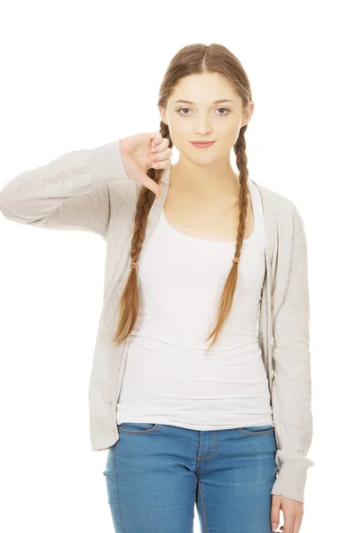 Young woman with thumbs down. — Stock Photo, Image