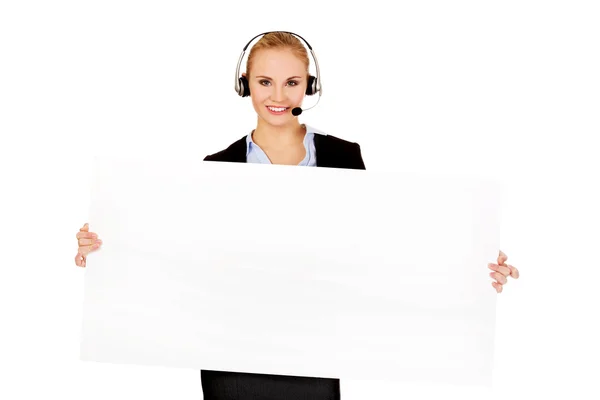 Glimlach call center vrouw met lege banner — Stockfoto