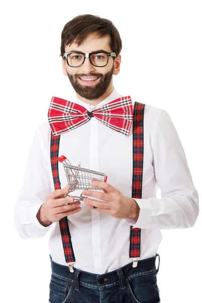 Man wearing suspenders with small shopping basket. — Stock Photo, Image