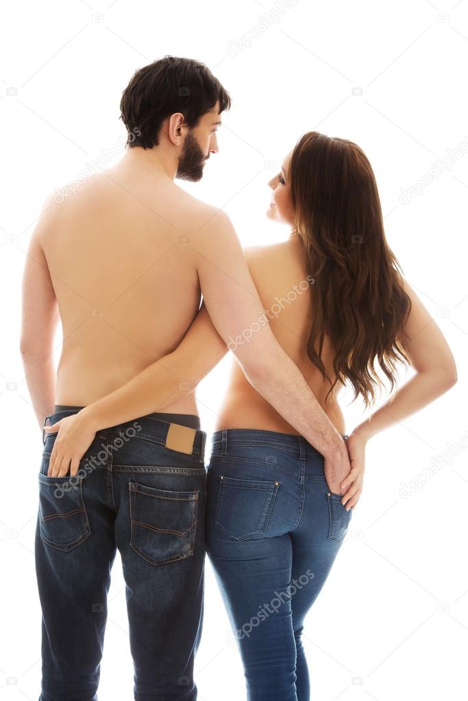 Couple holding their hands in each other pocket.