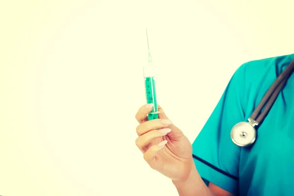 Female nurse or doctor hand holding syringe — Stock Photo, Image