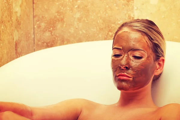 Woman sitting in a bath with closed eyes — Stock Photo, Image