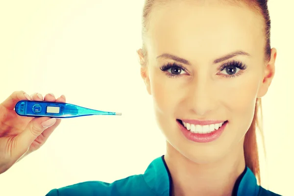 Attractive doctor with a thermometer. — Stock Photo, Image