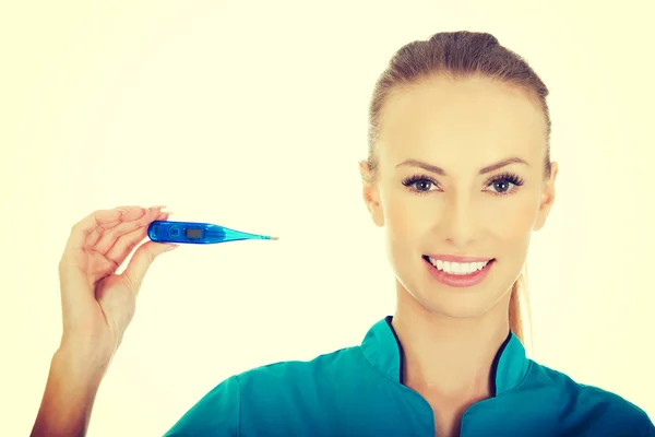 Attractive doctor with a thermometer. — Stock Photo, Image