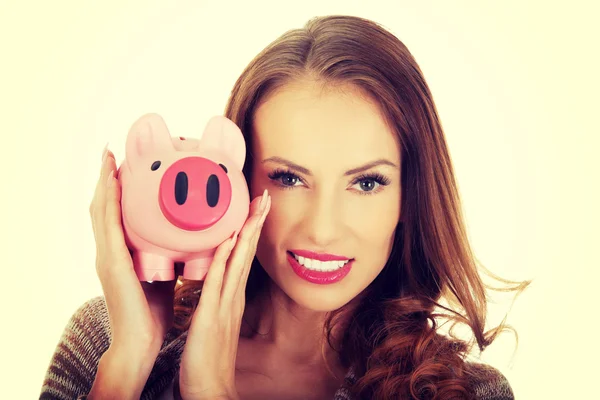 Piggy bank tartó alkalmi női. — Stock Fotó