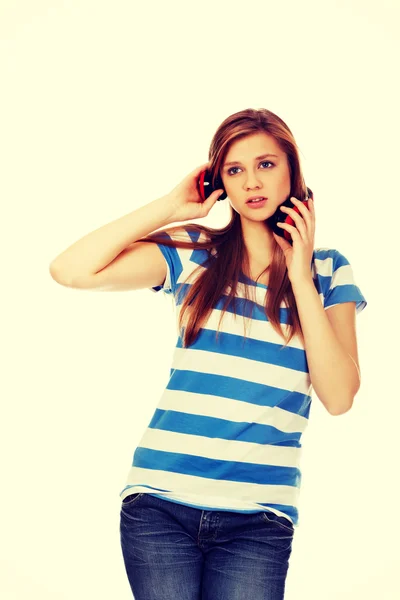 Teenage woman with red headphones — Stock Photo, Image