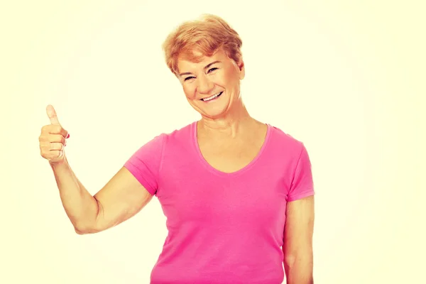 An old smilig woman with thumb up — Stock Photo, Image