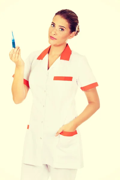 Nurse holding thermometer — Stock Photo, Image