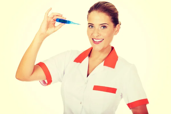 Verpleegkundige bedrijf thermometer — Stockfoto