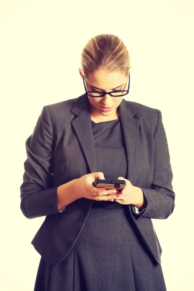 Businesswoman sending a message — Stock Photo, Image