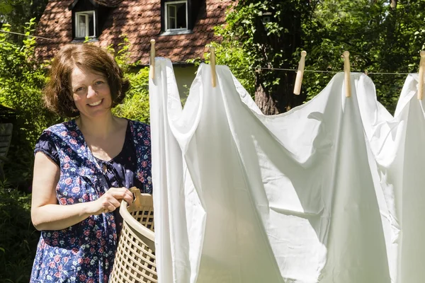 Hanging up the washing in — Stock Photo, Image