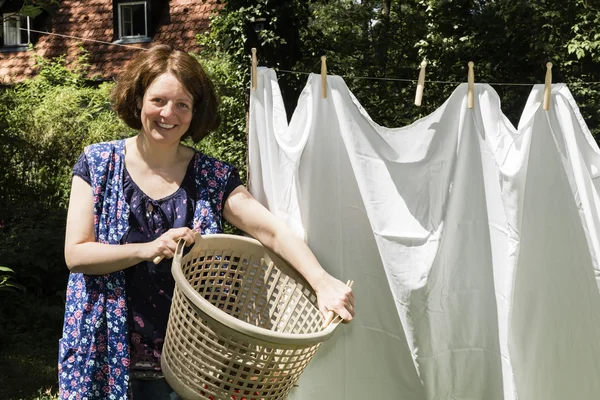 Hanging up the washing in — Stock Photo, Image