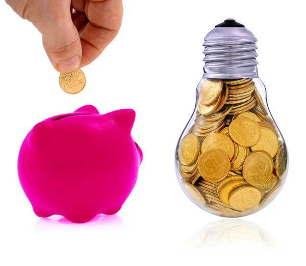 Traditional  lightbulb with  golden coins and pink piggy bank — Stock Photo, Image