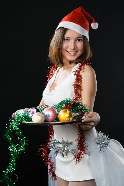 Leuk meisje met Kerstmis speelgoed — Stockfoto